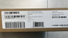 Cardboard box with a barcode label on a reflective surface